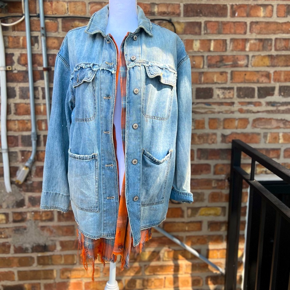 Free people jean jacket with orange fabric accents. Size small